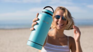 woman holding blue tumbler